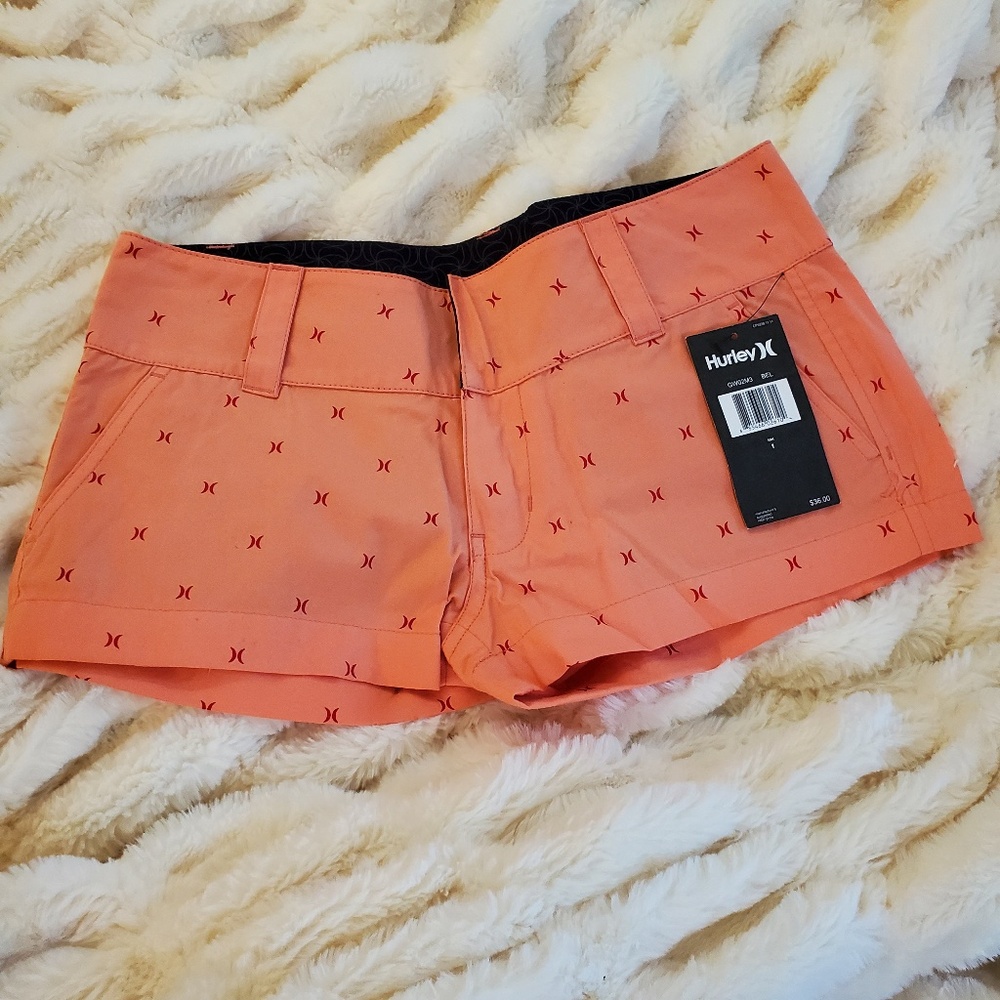NWT Hurley Shorts in Vibrant Coral with subtle Hurley logo pattern